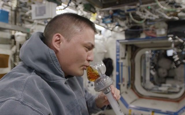 The 3D-printed coffee cup in use on the ISS.