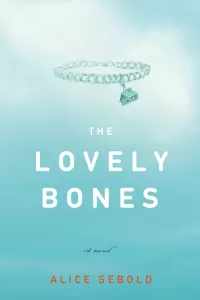 The cover of The Lovely Bones features a charm bracelet with a house, floating in a cloudy blue sky.